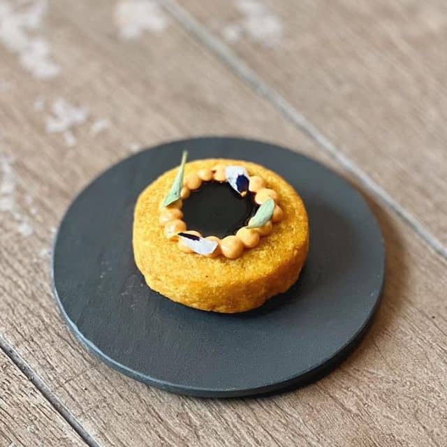 Snack of the day! A cripsy corn fritters bomba filled with braised beef cheek ragout, topped with chipotle and port wine sauce! The perfect snack before a hearty meal. #focrestaurant #restaurantsg #restaurant #foodie #foodstagram #foodgasm #foodporn #instafood #foodloversofinstagram