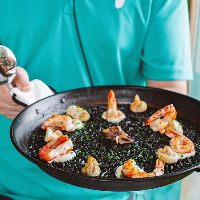 An iconic signature dish, Black Mediterranean Squid Ink Paella. This is an absolute must-try dish for seafood lovers, packed with Mediterranean flavours, one mouthful gives you a burst of smoky seafood flavours - hard to stop once tried! 🥘🥘⛱⛱ #focsentosa #sentosasg #beachrestaurant #beach #beachlife #ıslandlife #summervıbes #foodie #restaurant  #restaurantsg #restaurant #foodie #foodstagram #foodgasm #foodporn #instafood #foodlovers #fresh #sea #seafoodlovers #paella #paellalovers